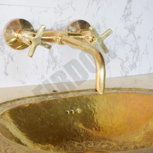 Brass wall-mounted bathroom sink faucet trim with a brass spout and brass cross handles, Unlacquered Brass